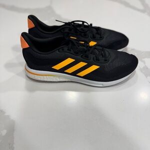 Adidas Supernova M 'Black Flash Orange' running shoe with model number GX2964.